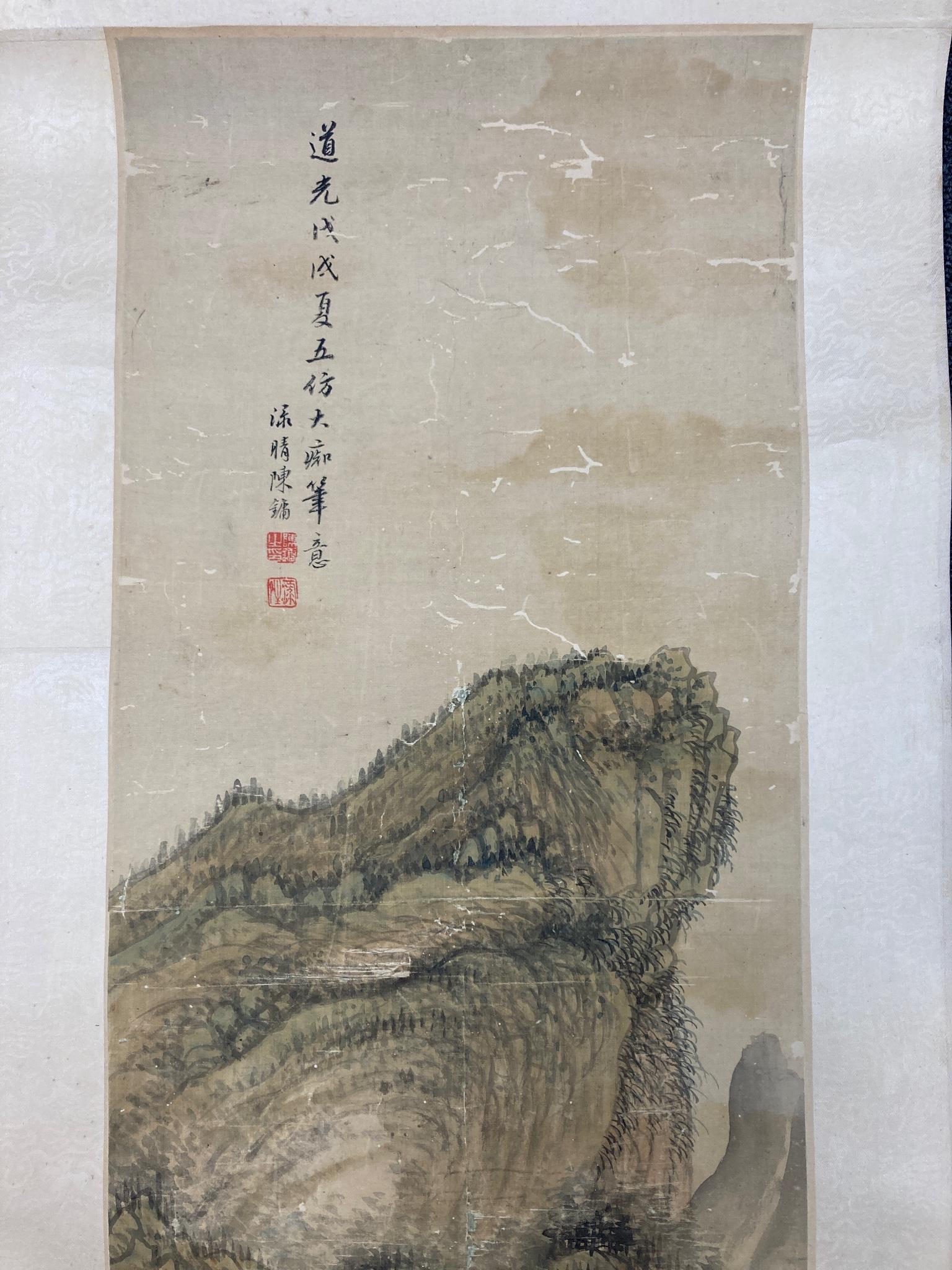 A Chinese landscape scroll painting on silk, Qing dynasty inscribed and signed, artist’s seal and collector’s seal lower left, image 139cm x 27.5cm, remounted